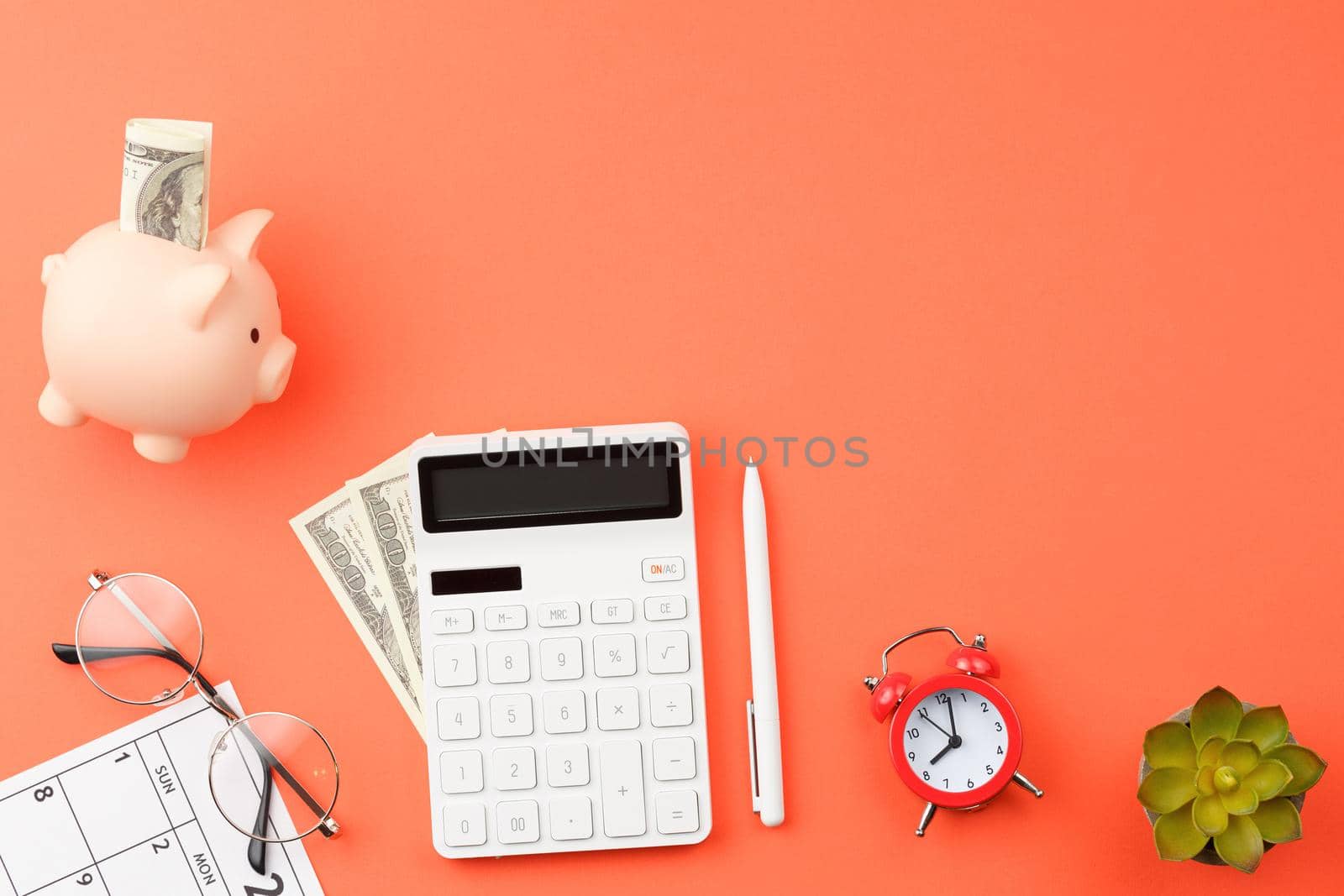 Office desk with calendar, calculator and glasses. by alexxndr