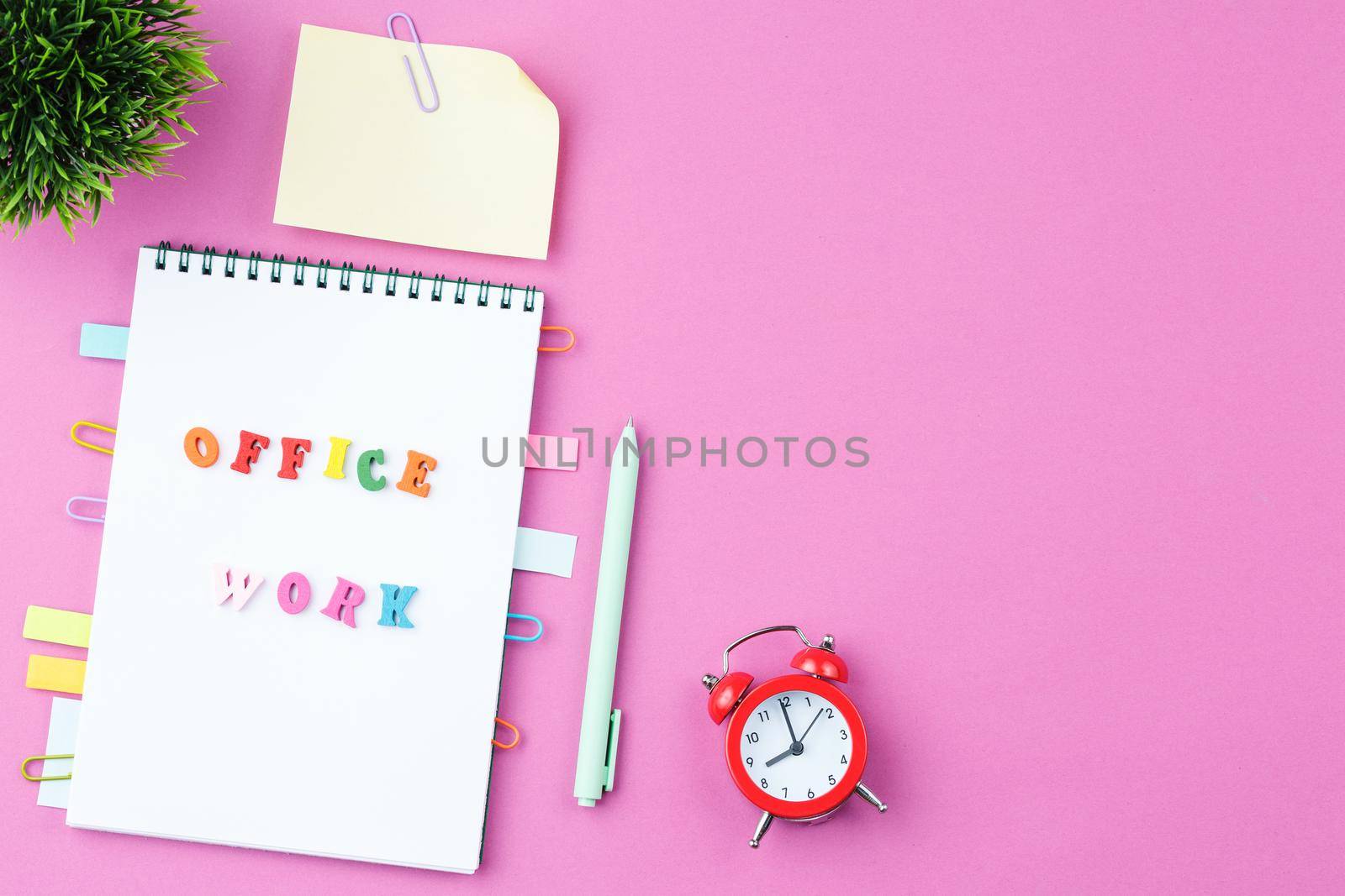 Notepad with wooden words on pink background by alexxndr