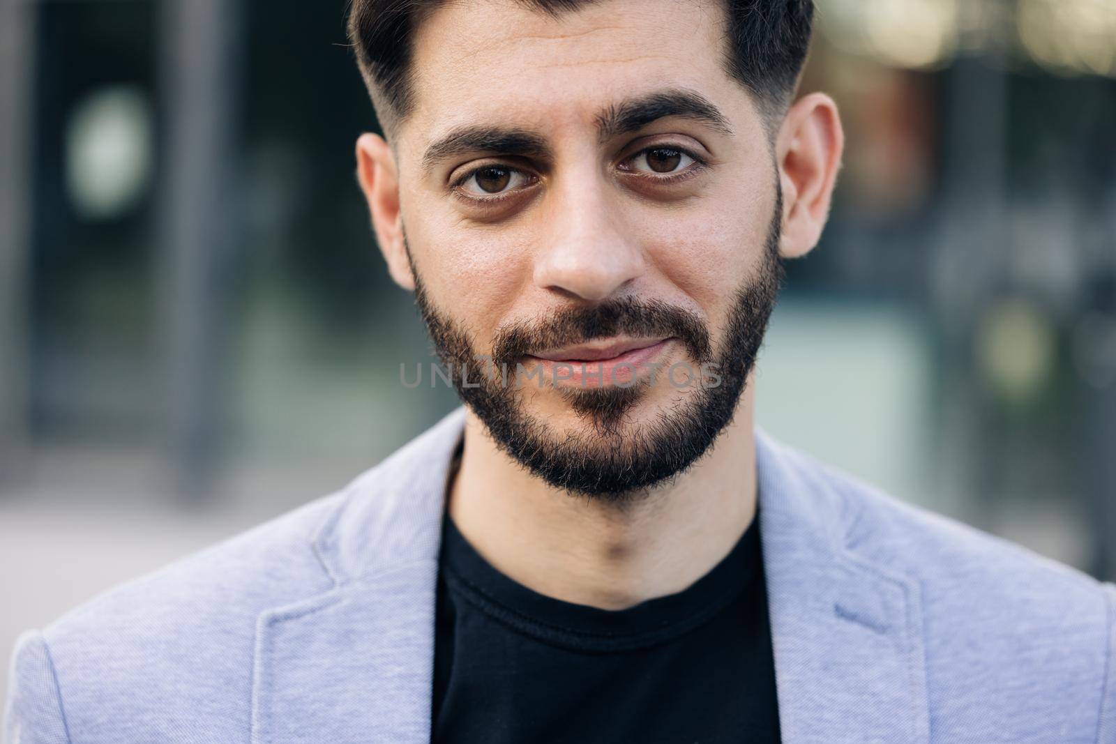 Smiling caucasian young bearded man in formal outfit looking to camera outside on street feel happy businessman portrait business modern manager pretty.