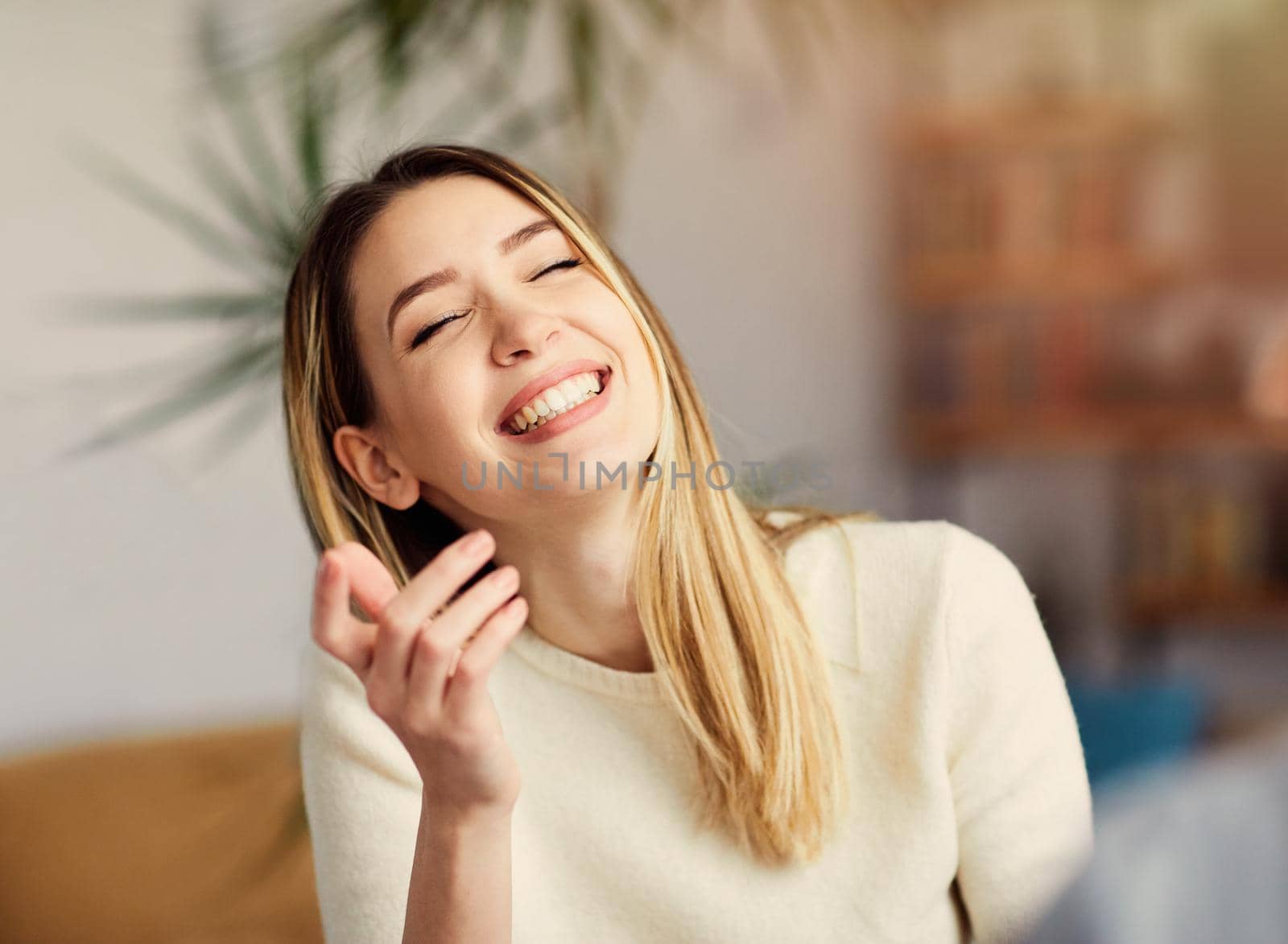 Portrait of a young happy girl talking with a friend