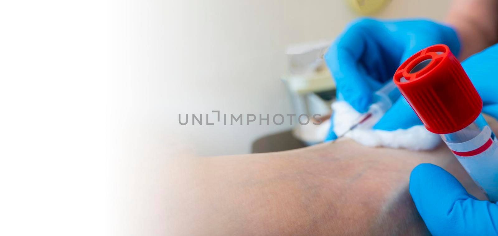 Close up nurse pricking needle syringe in the arm patient drawing blood sample for blood test banner with space for text