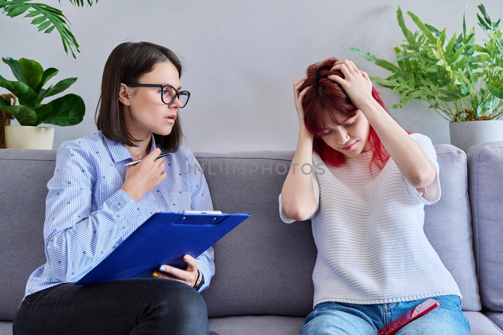 Professional psychologist working with teenage student girl. Female patient stressed out, individual therapy, help to teenager. Mental health, counseling, adolescence, psychology, psychiatry concept