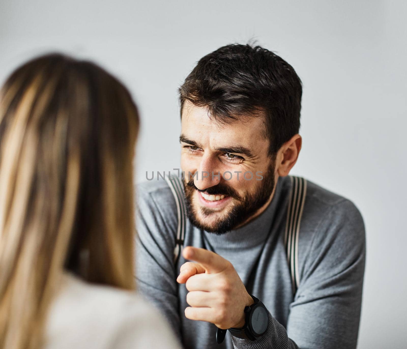 Portrait of two young business people having a meeting in the office. Teamwork and success concept