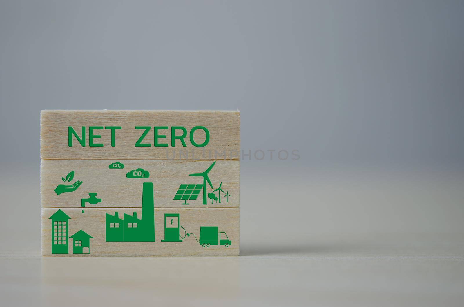 wooden cube block Net zero Carbon neutral concept. green icon on background.