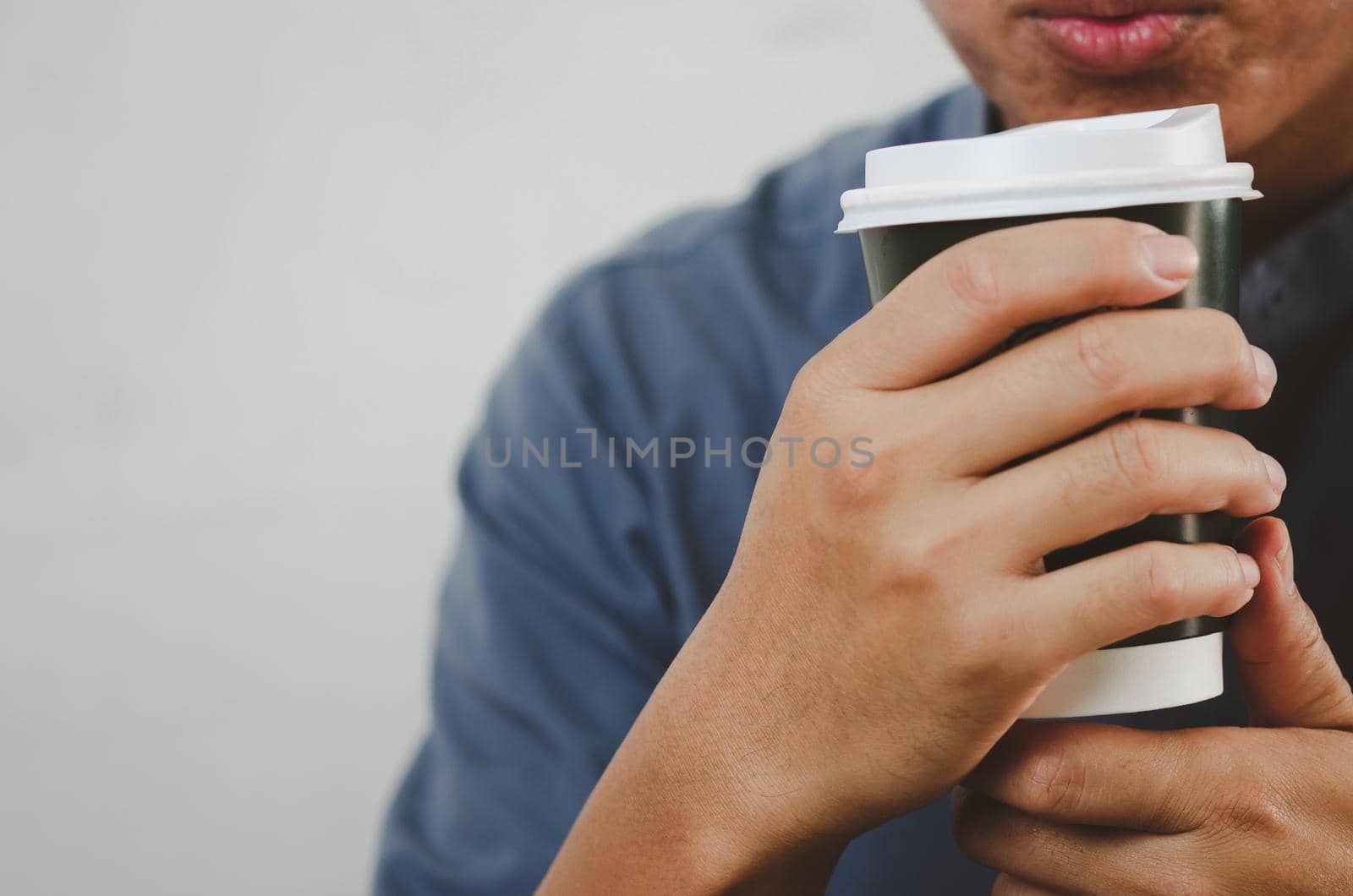man drinking coffee paper cup copy space. by aoo3771