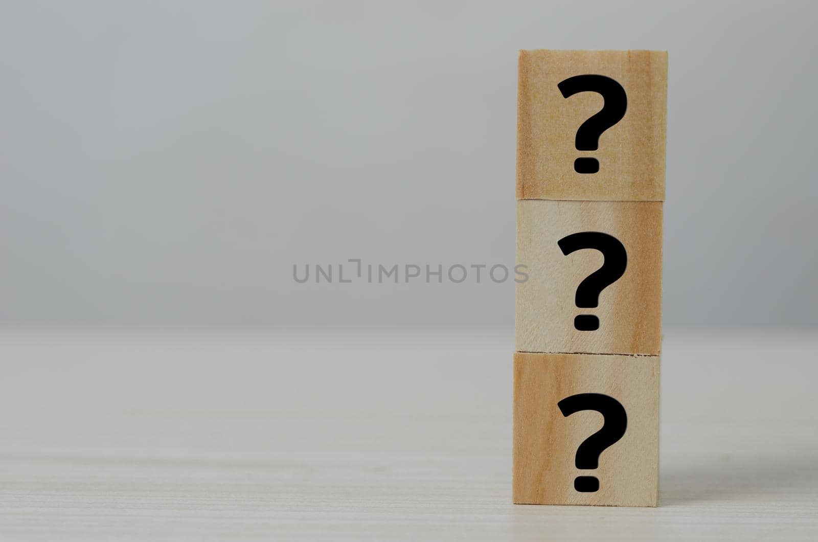 Square wooden block icon question mark symbol copy space. by aoo3771