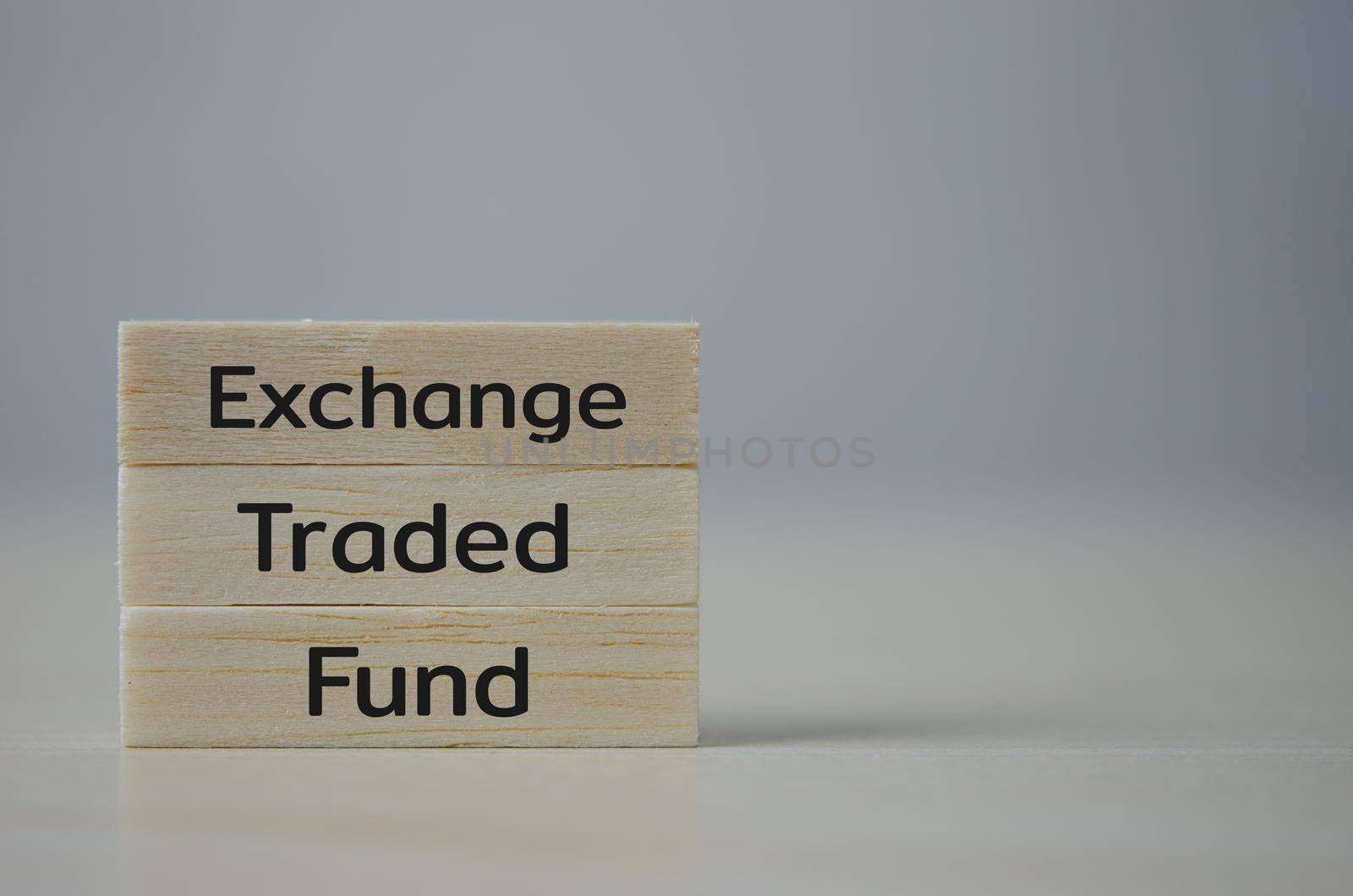 wooden cube block icon ETF Exchange Traded Fund on table.Business stock market finance Index Fund Concept.  by aoo3771