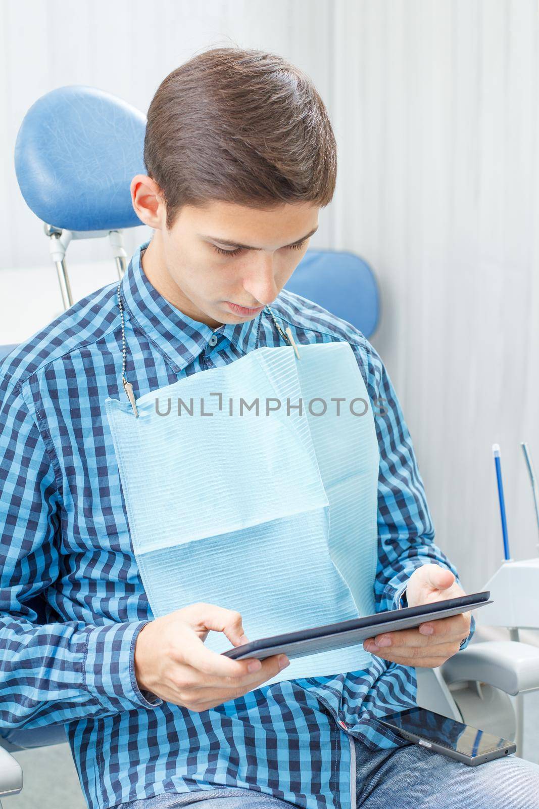 Handsome young man in visit at the dental office. Dentistry by mvg6894