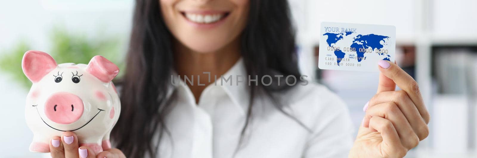 Portrait of woman hold piggybank money container in one hand and credit card in another. Best options for saving up for future. Finance, investment concept