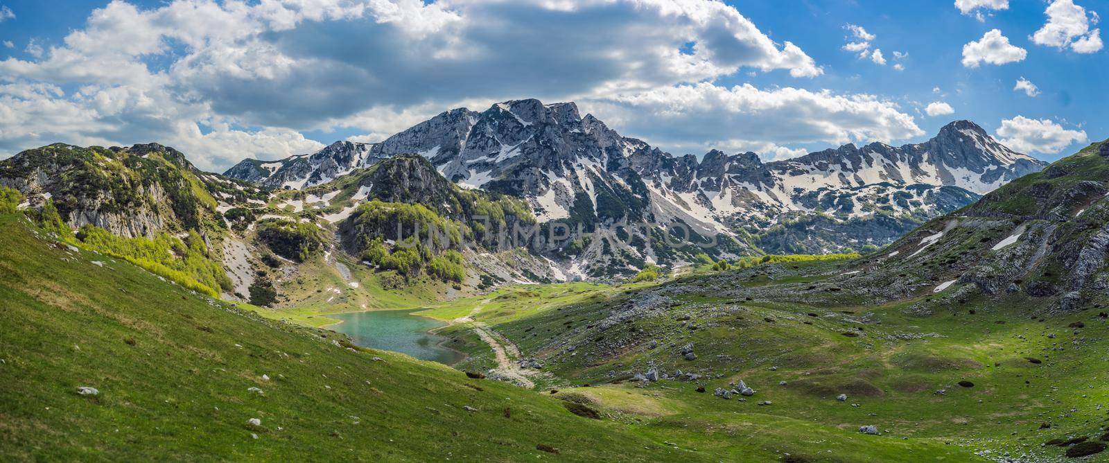 Mountain lake landscape on Durmitor mountain in Montenegro beautiful Durmitor National park with lake glacier and reflecting mountain.