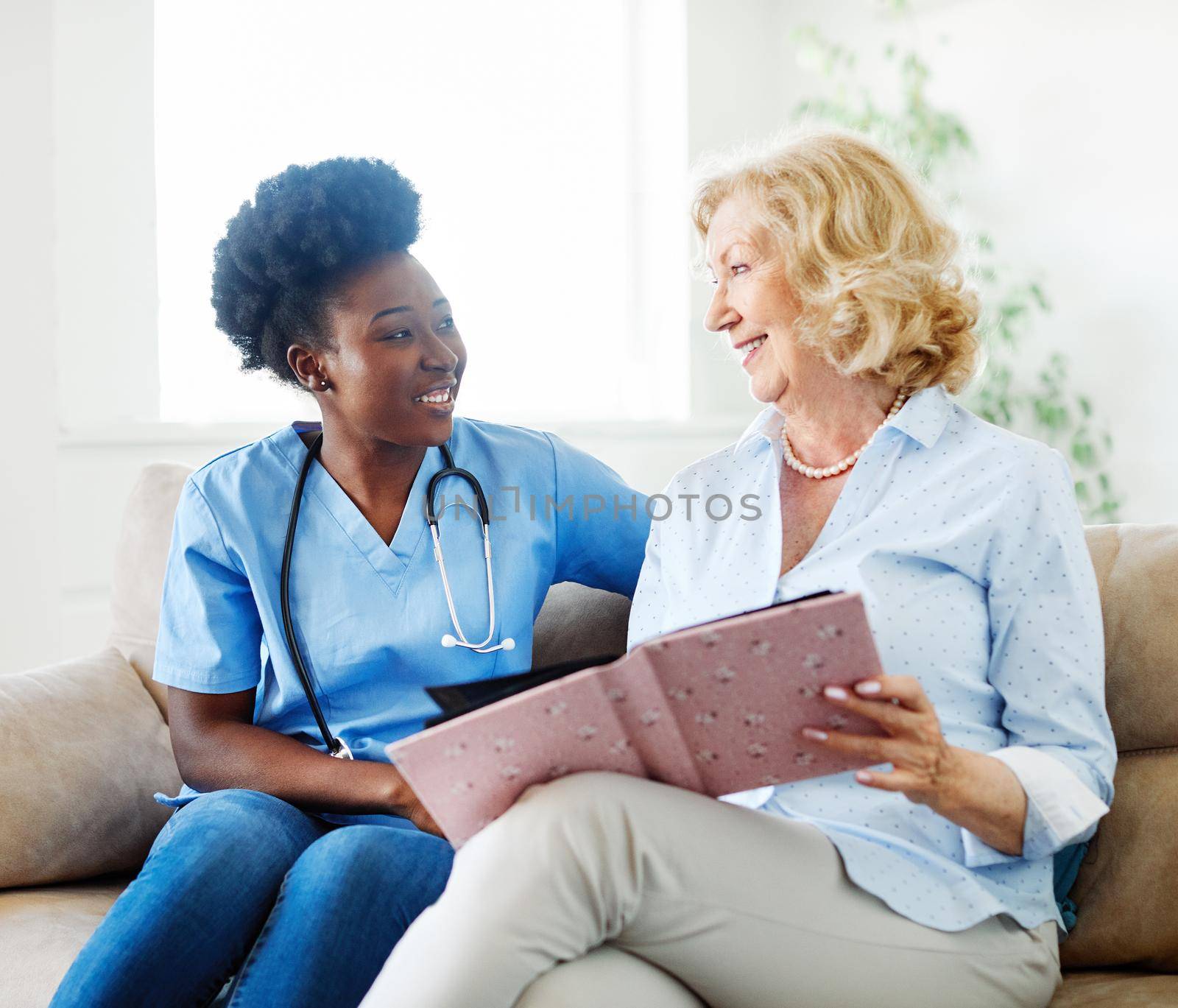 nurse doctor senior care caregiver help assistence retirement home nursing elderly woman health support african american black by Picsfive