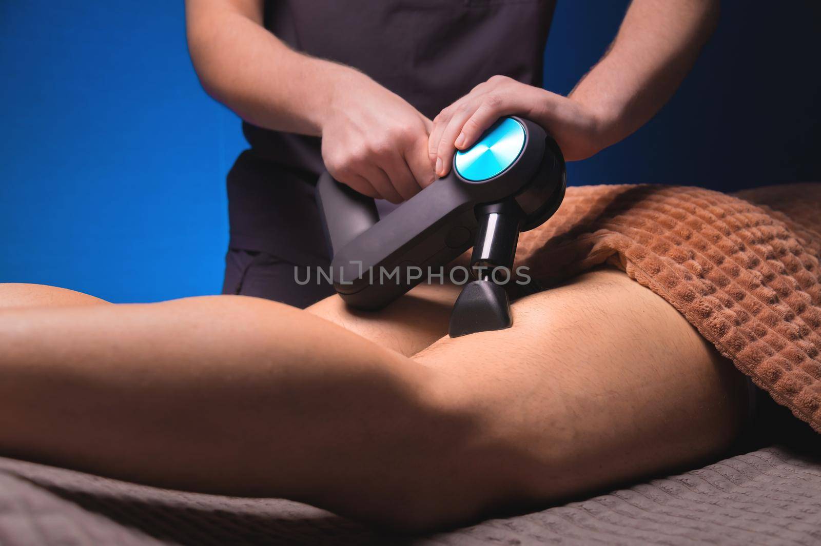 Close-up percussion thigh massage with a special electric device by yanik88