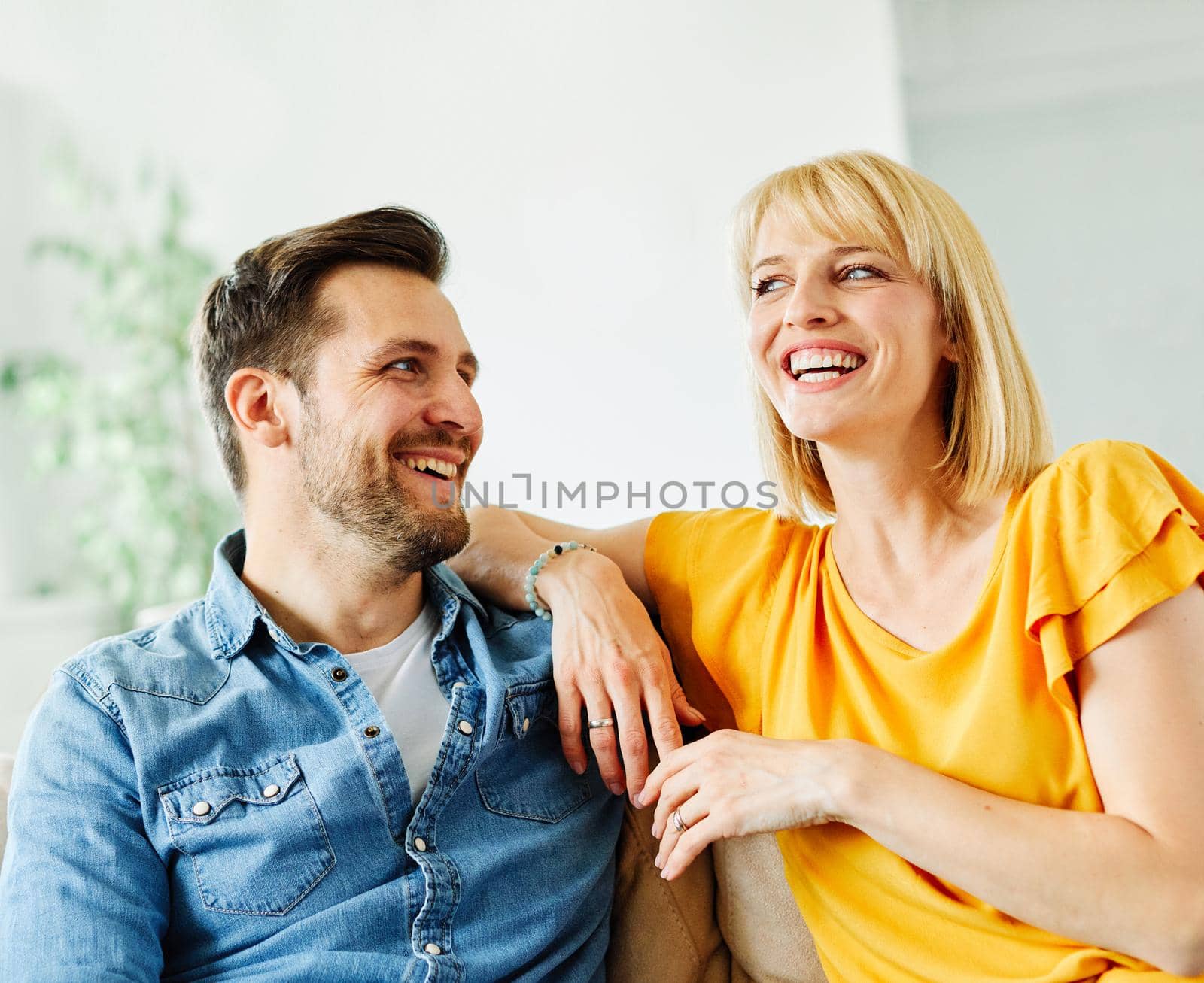 Portrait of a lovely young couple together at home