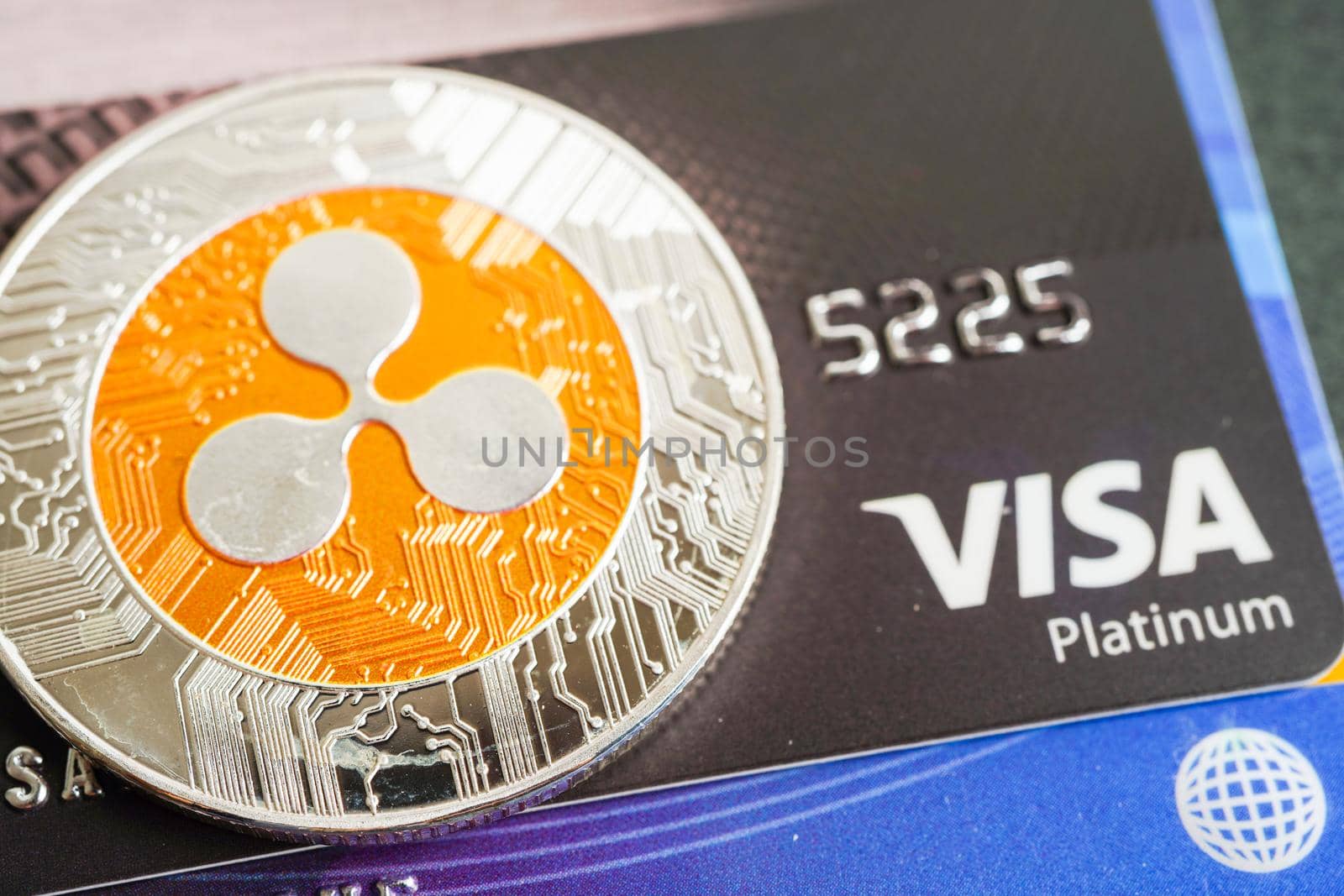 Bangkok, Thailand - December 15, 2021 Golden bitcoin with credit card on US dollar banknotes money for business and commercial, Digital currency, Virtual cryptocurrency.