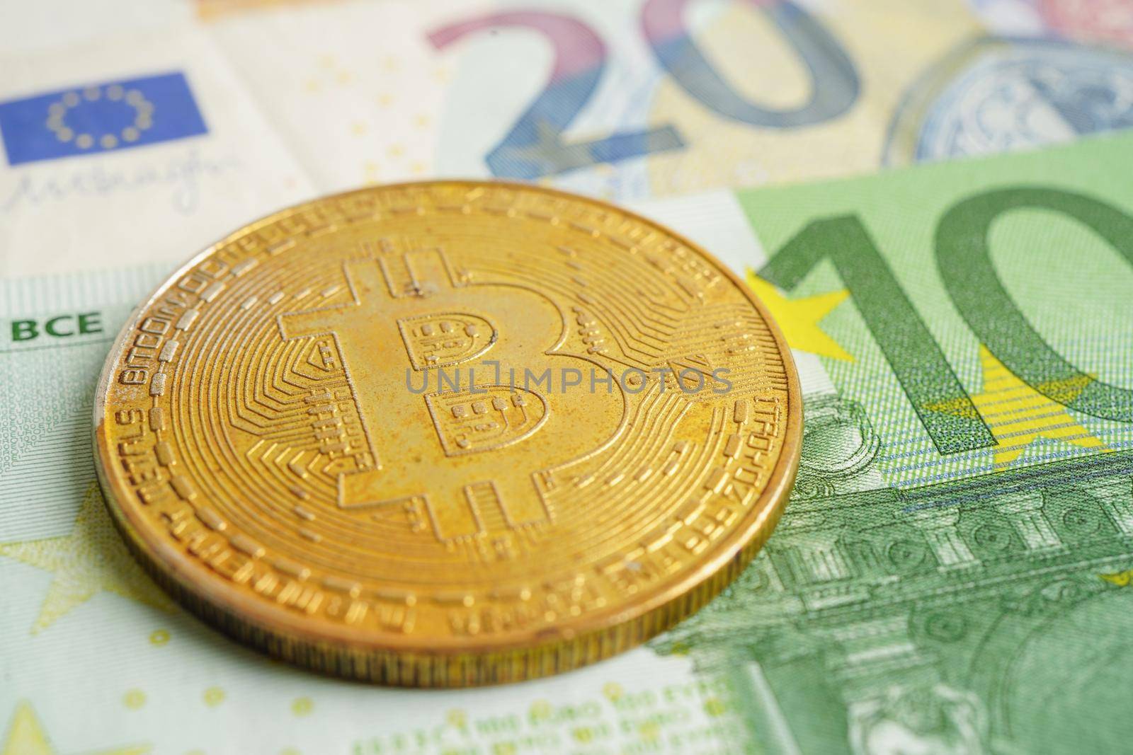 Golden bitcoin on Euro banknotes money for business and commercial, Digital currency, Virtual cryptocurrency.