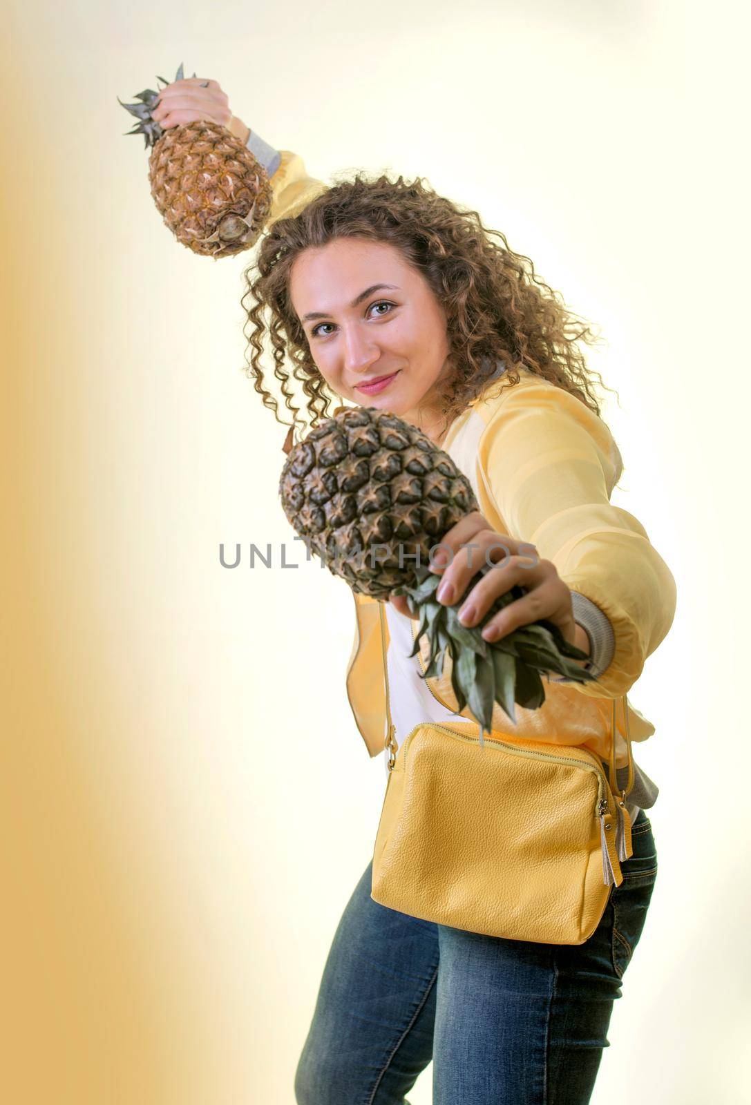 beautiful young woman with pineapple isolated on white