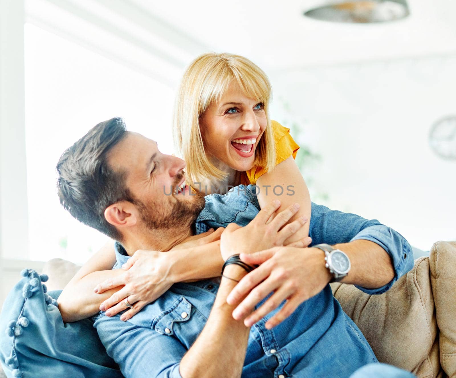 Portrait of a lovely young couple together at home