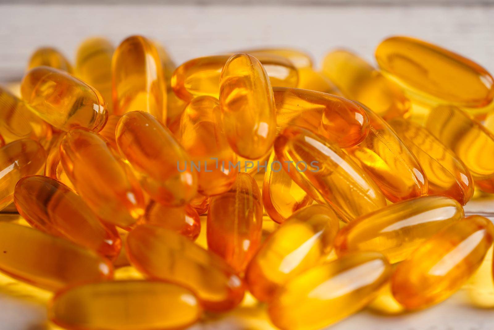 Fish oil or Cod liver oil gel in capsules with omega 3 vitamins, supplementary healthy food 