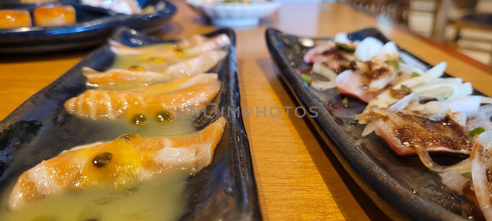 japanese food dish in an oriental restaurant with wooden table and light background