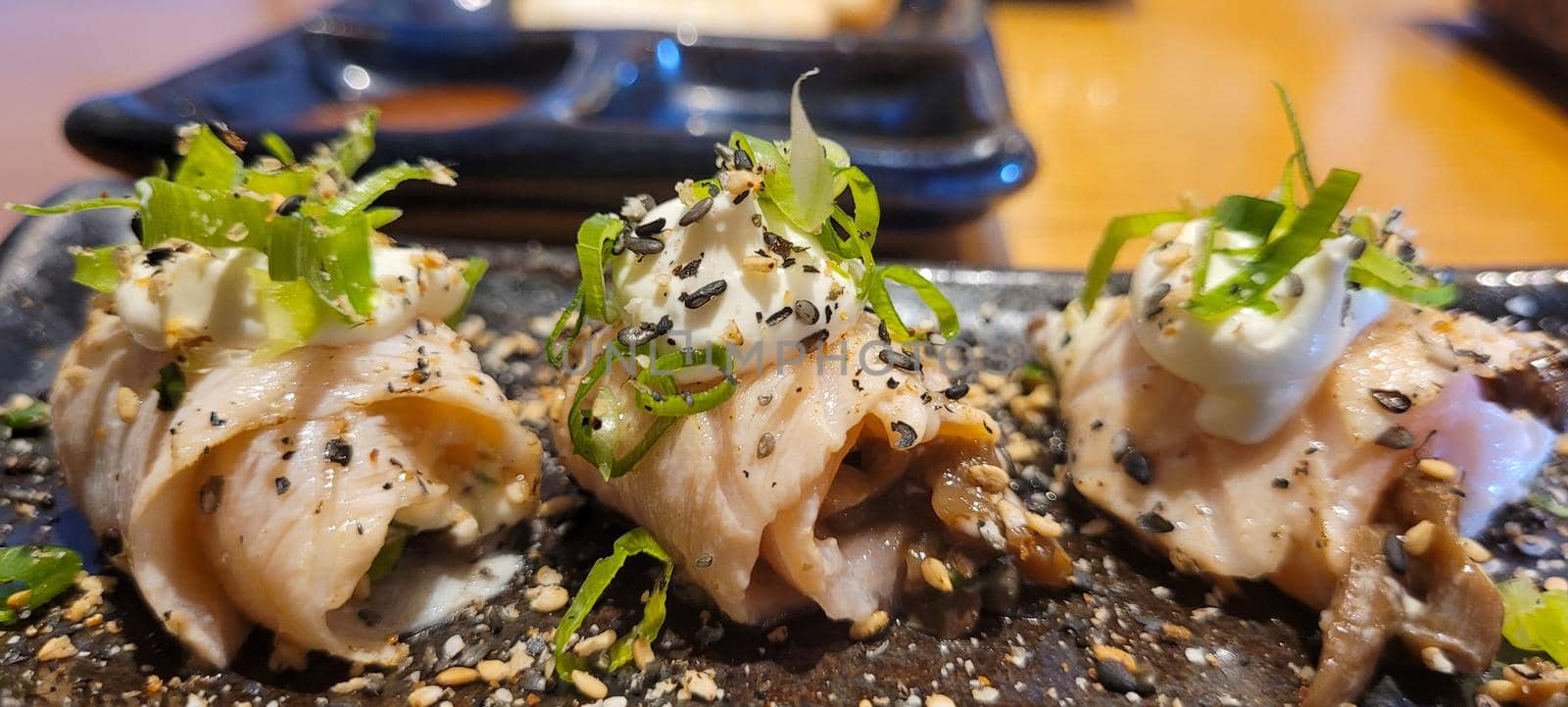 japanese food dish in an oriental restaurant with wooden table and light background