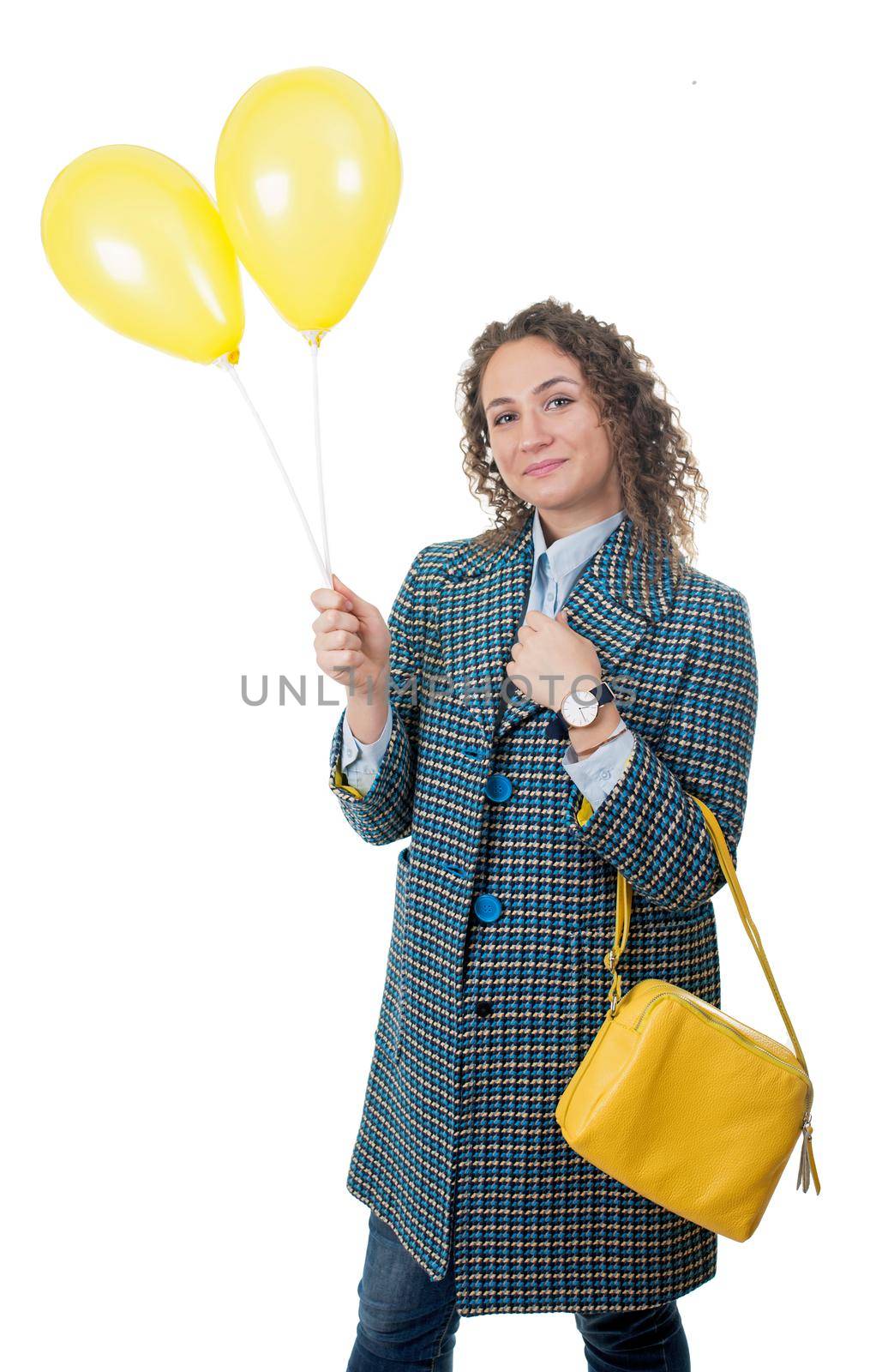 Beautiful young girl walks with yellow balloons by aprilphoto