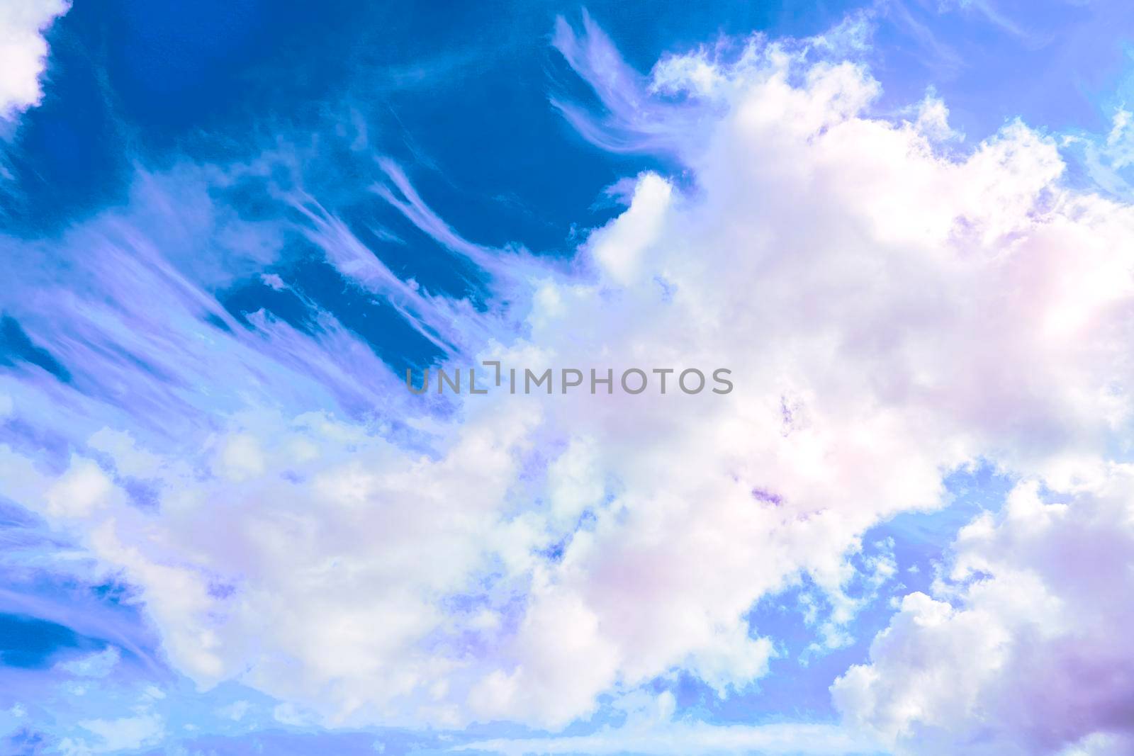 Saturated blue sky with flying pink clouds by jovani68