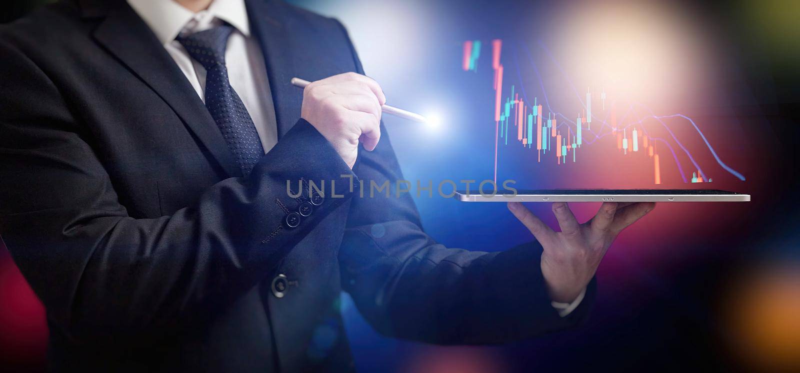 Businessman holding stock tablet ,virtual technical investment graph chart for analysis stock market , Banking financial and planing concept. by Maximusnd
