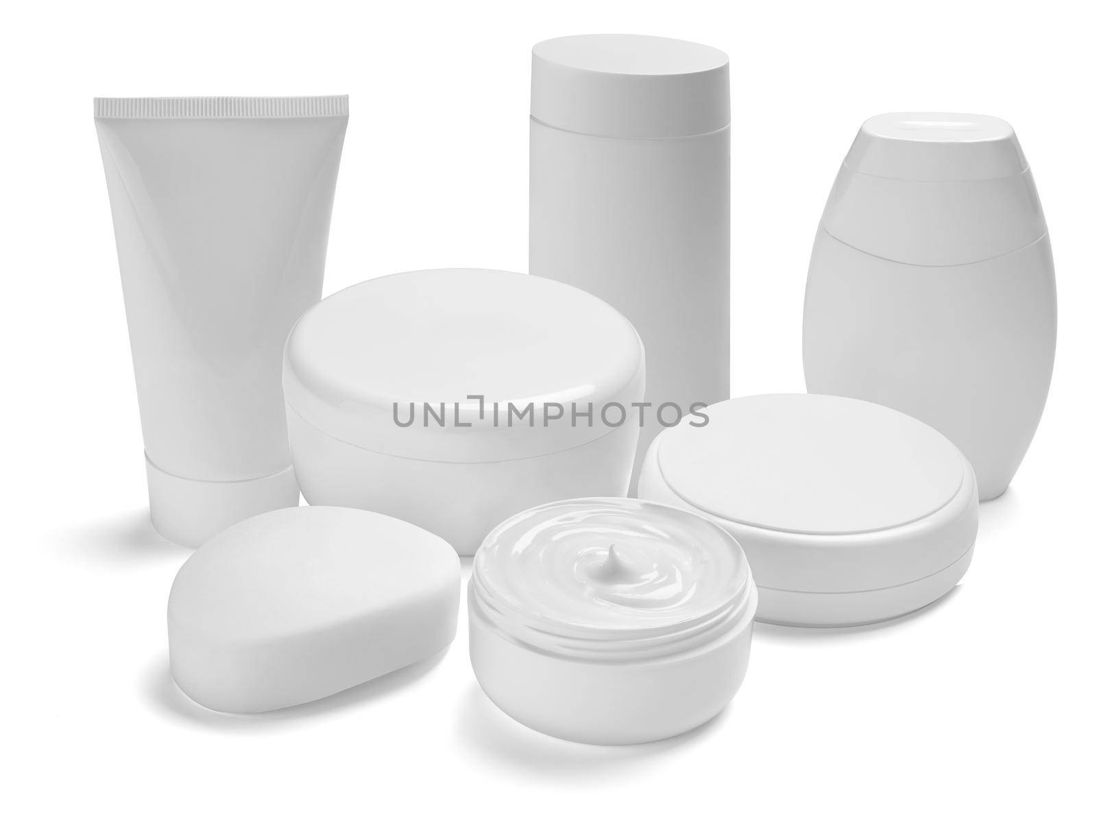 close up of a white beauty cream container and tube on white background