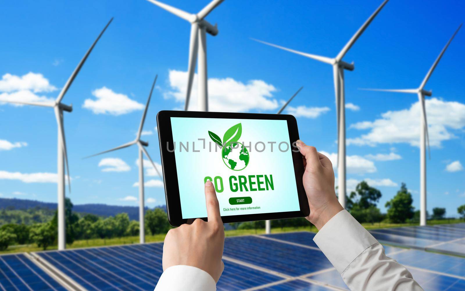 Green business transformation for environment saving and ESG business concept. Businessman using tablet to set corporate goal toward environmental friendly management and alternative clean energy use.