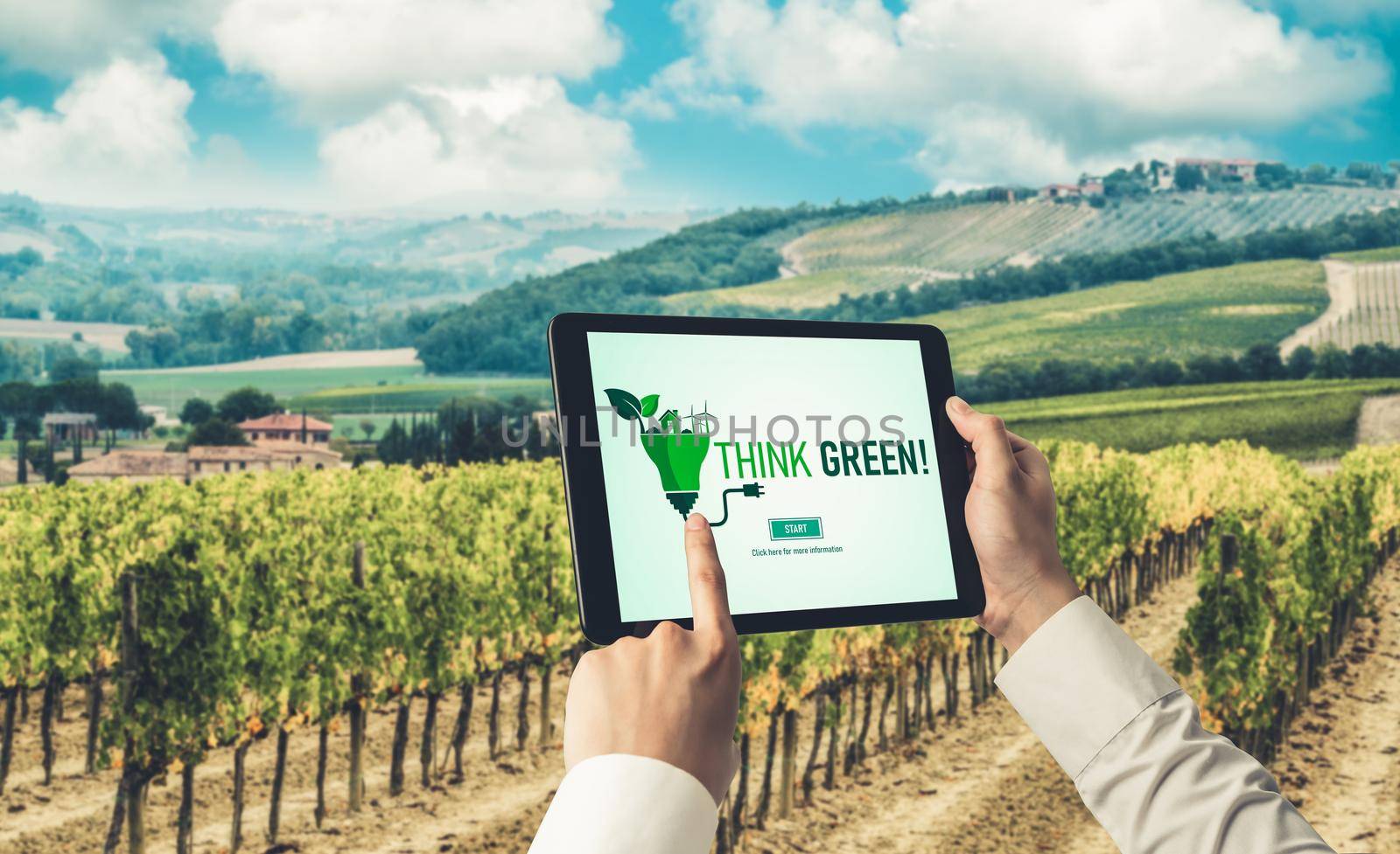 Green business transformation for environment saving and ESG business concept. Businessman using tablet to set corporate goal toward environmental friendly management and alternative clean energy use.
