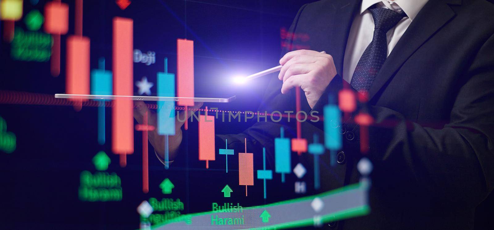 Businessman holding stock tablet ,virtual technical investment graph chart for analysis stock market , Banking financial and planing concept. by Maximusnd