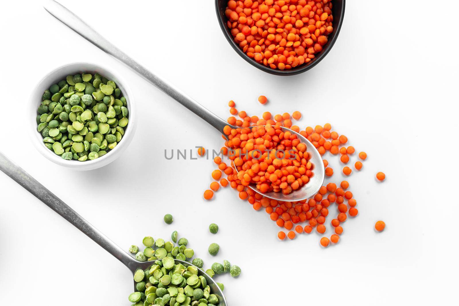 Red Lentils and green peas on a white background. superfood healthy food alternative to basic cereals. Gluten free. by gulyaevstudio