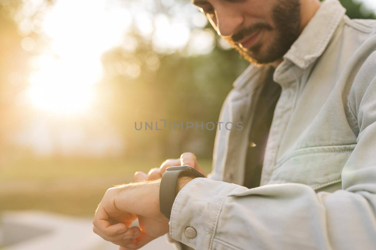 Touch Screen Wearable Technology Smart Band. Bearded Man Using Smart Watch Wearable Wristband Device. Male Checking Pulse Smartwatch App. Businessman Scrolling On Display On Smartwatch Notification.