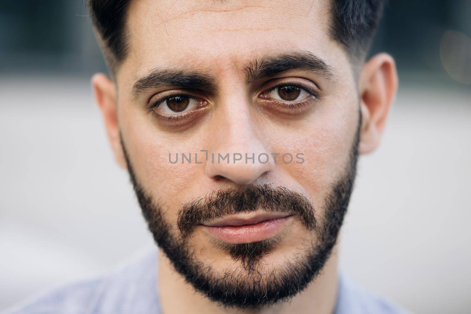 Portrait of nice-looking caucasian multi-race beautiful businessperson elegant young man looking into camera. Career people. Fashion, beauty. Male portraits. by uflypro