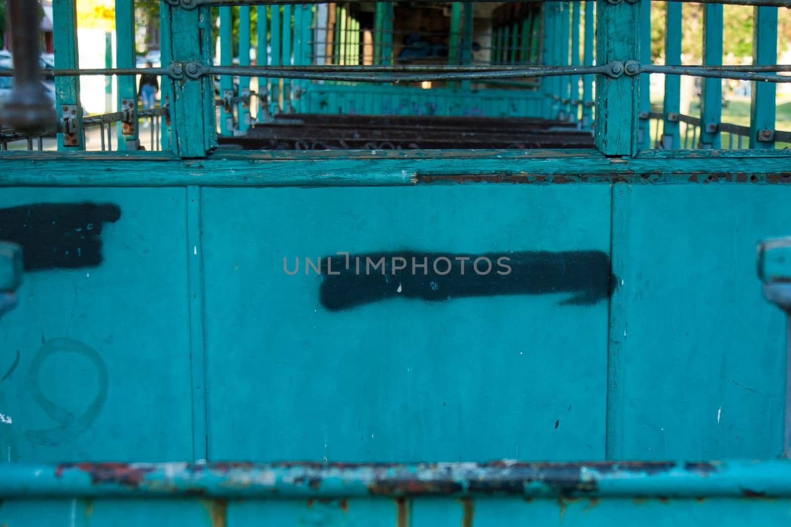 Inside old abandoned rusty wrecked tram by zebra