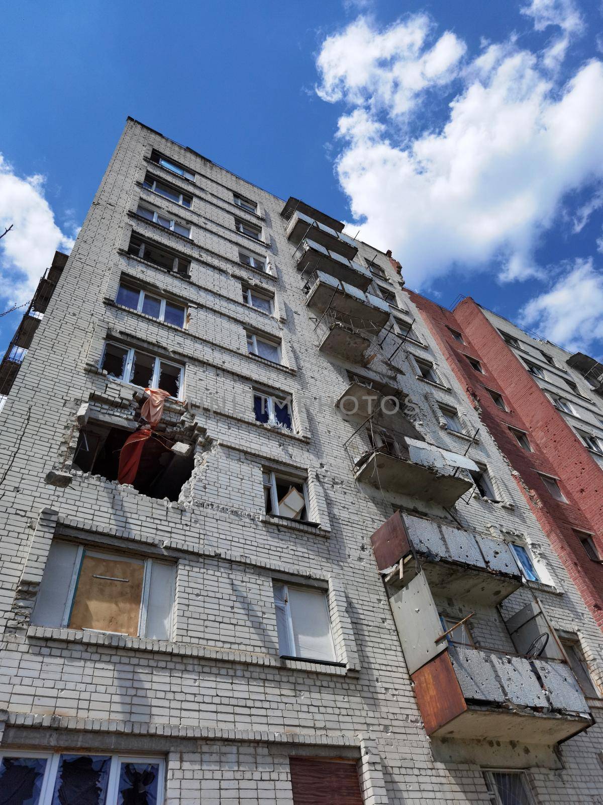 Chernihiv, Ukraine - June 27, 2022: War in Ukraine. Damaged ruined multi-storey house in ukrainian city Chernihiv near Kyiv on north of Ukraine. Ruins during War of Russia against Ukraine