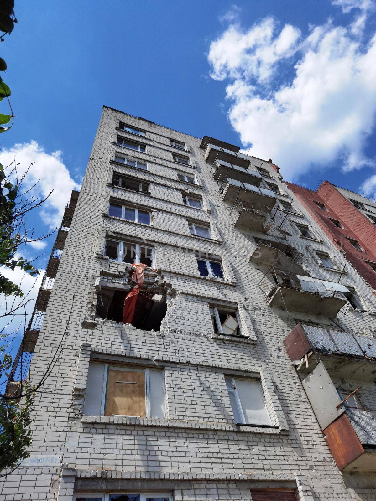 Chernihiv, Ukraine - June 27, 2022: War in Ukraine. Damaged ruined multi-storey house in ukrainian city Chernihiv near Kyiv on north of Ukraine. Ruins during War of Russia against Ukraine