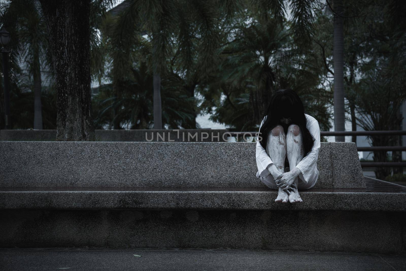 Woman ghost horror sitting her hug, by Sorapop