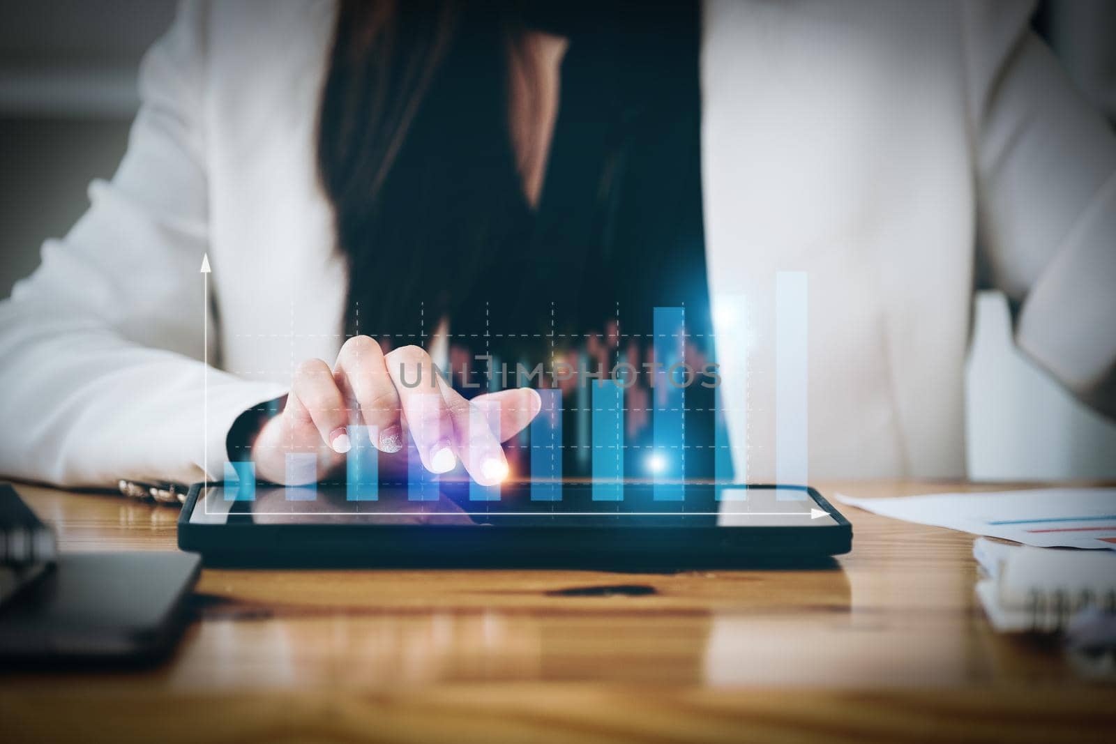 business woman using a tablet computer for data analysis, marketing, accounting.