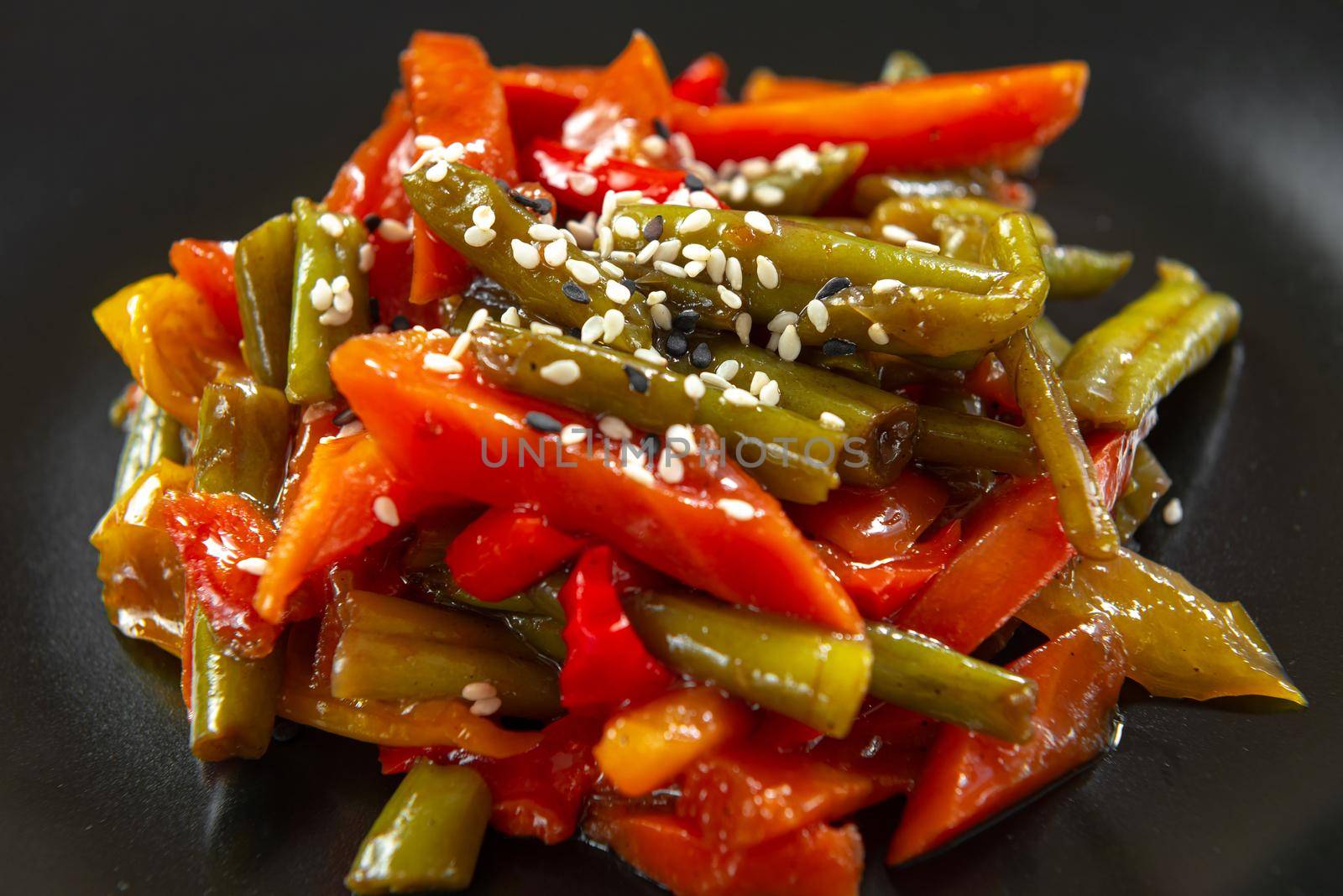 Asian street food in gravy. Korean Roasted Vegetables. Thai fried vegetables in sauce. Close up