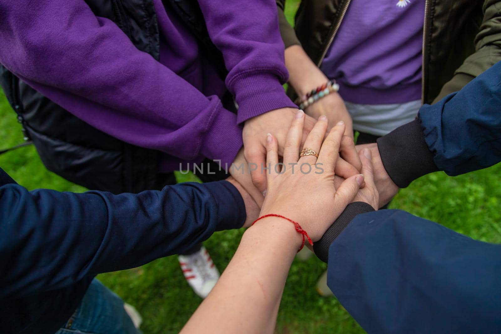 People put their hands together. Selective focus. Couple.