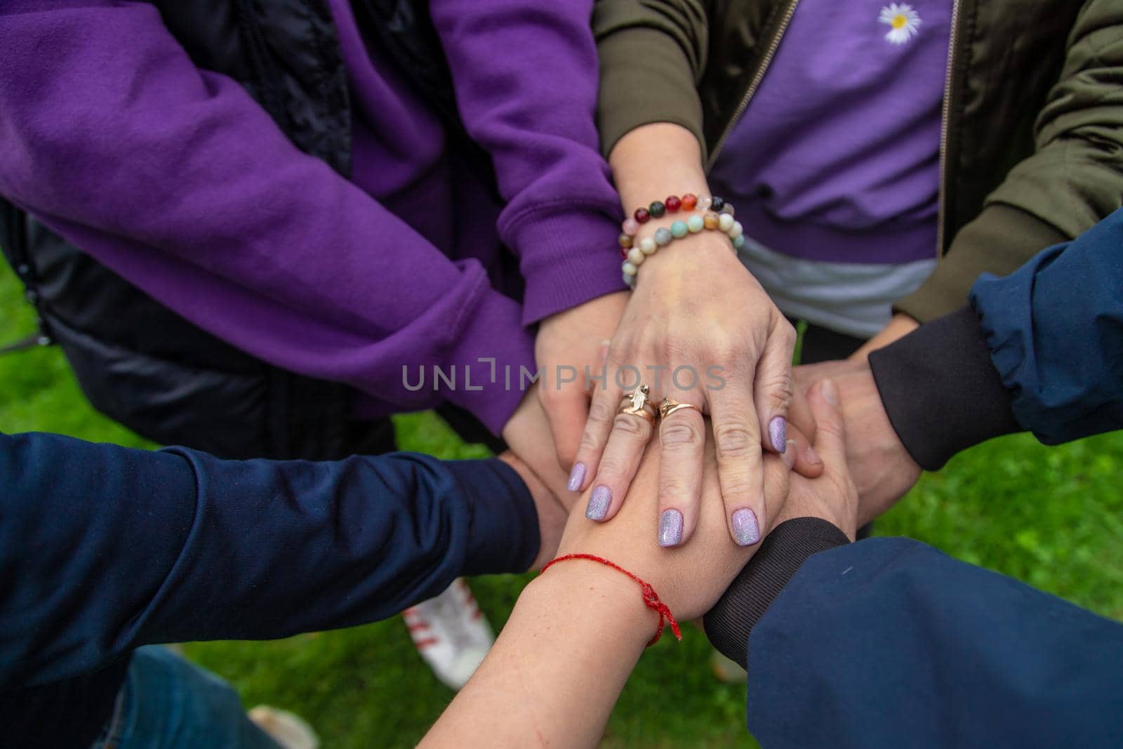 People put their hands together. Selective focus. Couple.