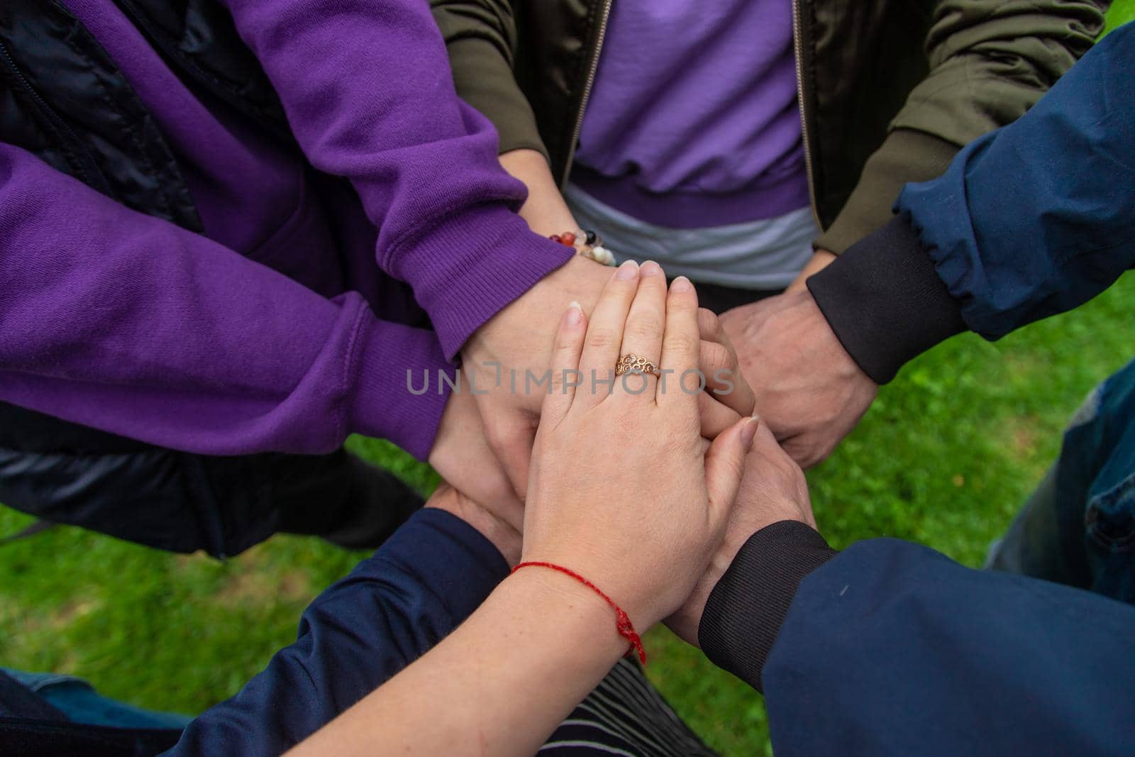 People put their hands together. Selective focus. Couple.