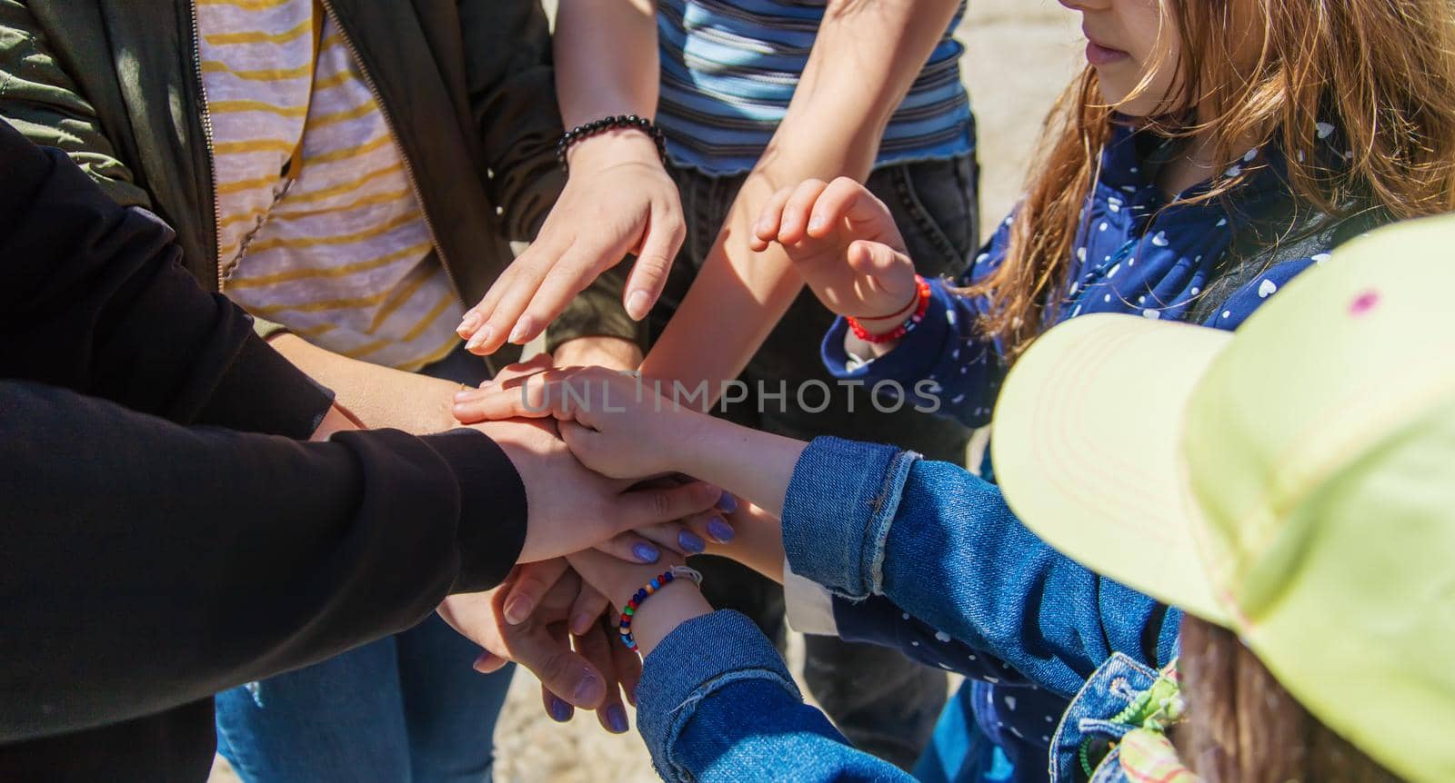 People put their hands together. Selective focus. Couple.