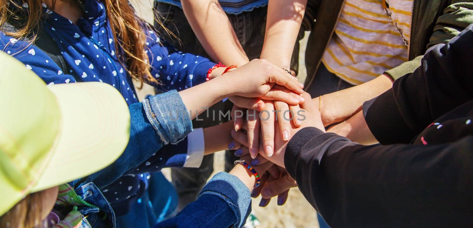 People put their hands together. Selective focus. Couple.