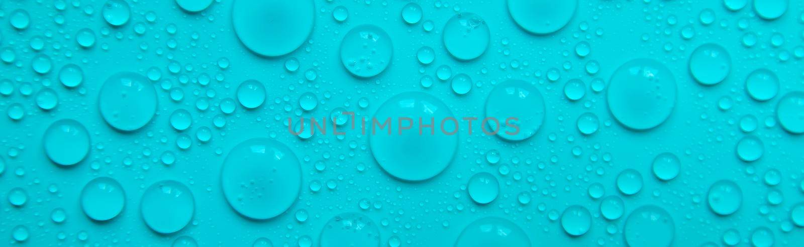Drops of liquid, moisturizing cosmetic product. Hyaluronic acid. Selective focus. Nature.