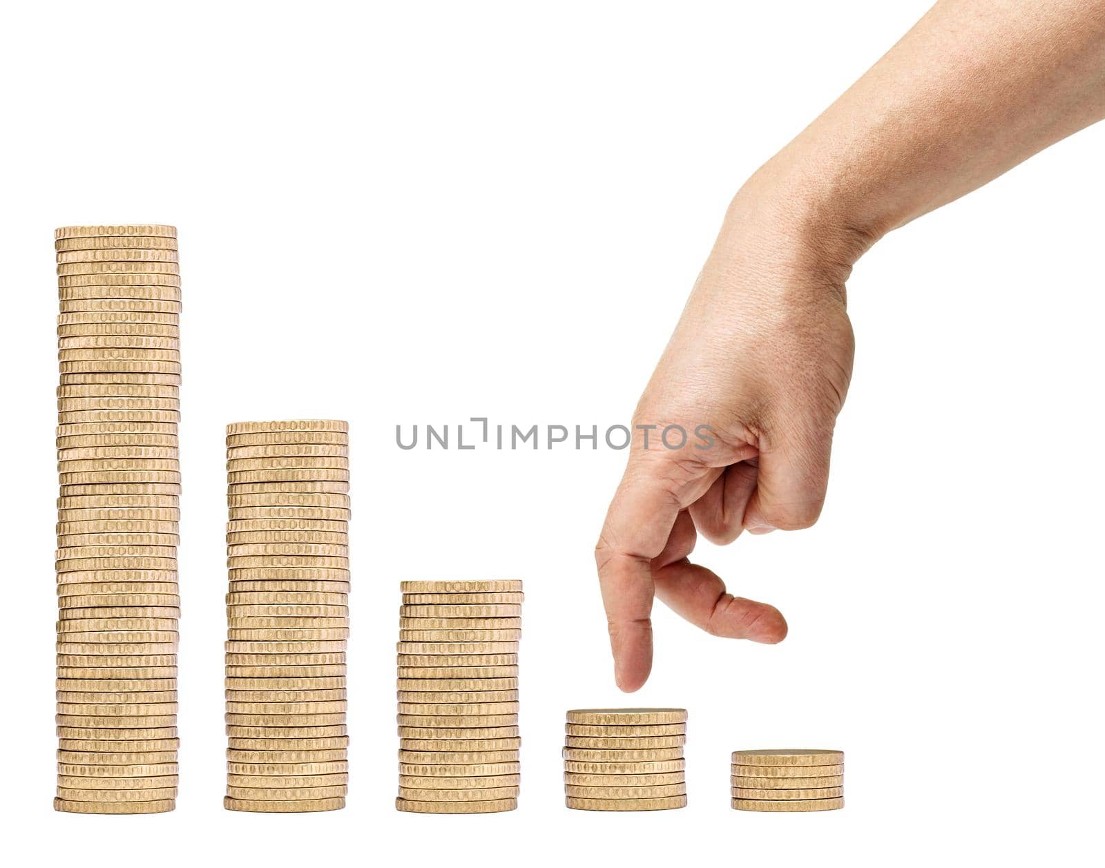 Close up of a male hand climbing over coins on white background