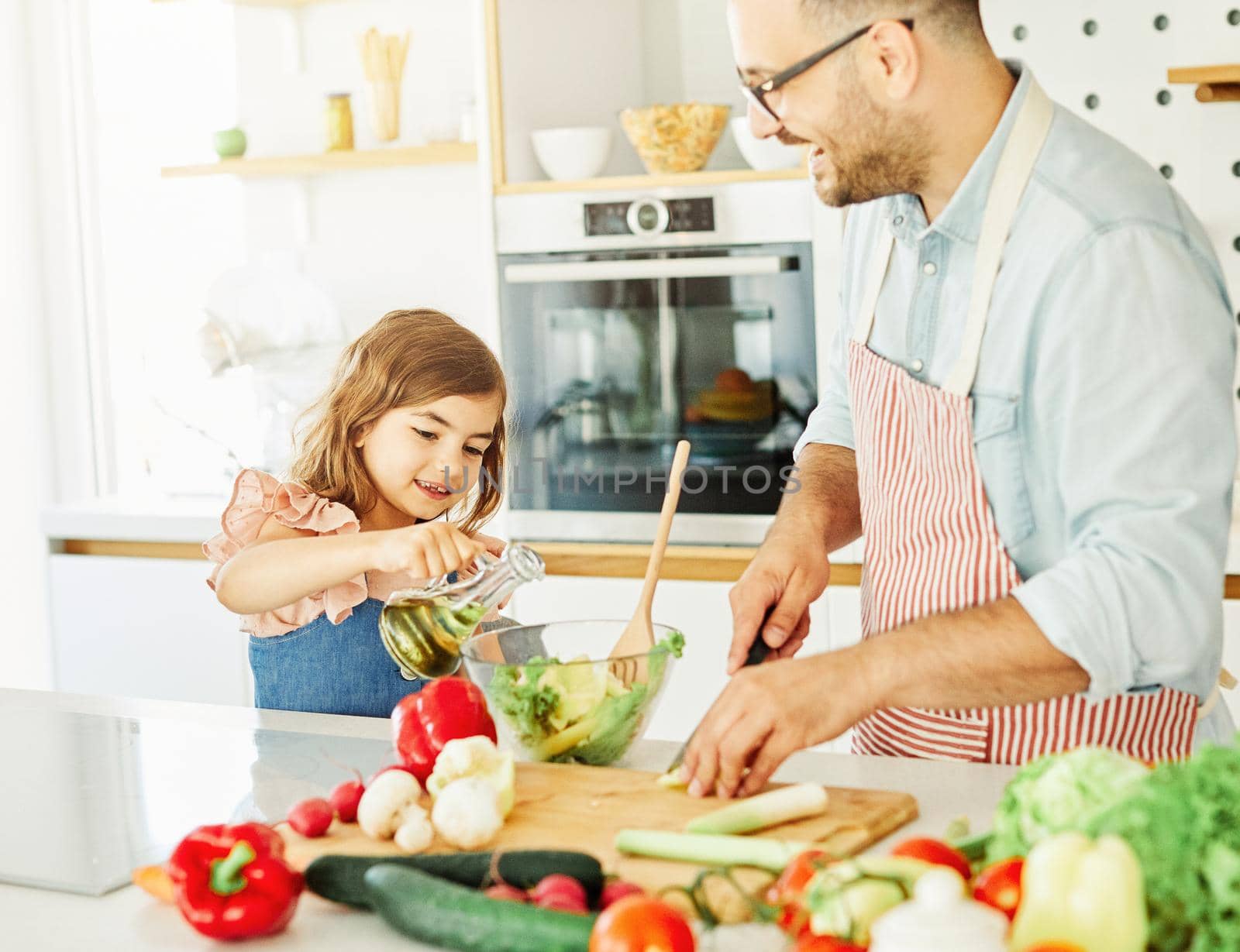 daughter father kitchen food preparing cooking child bonding happy girl together home parent by Picsfive