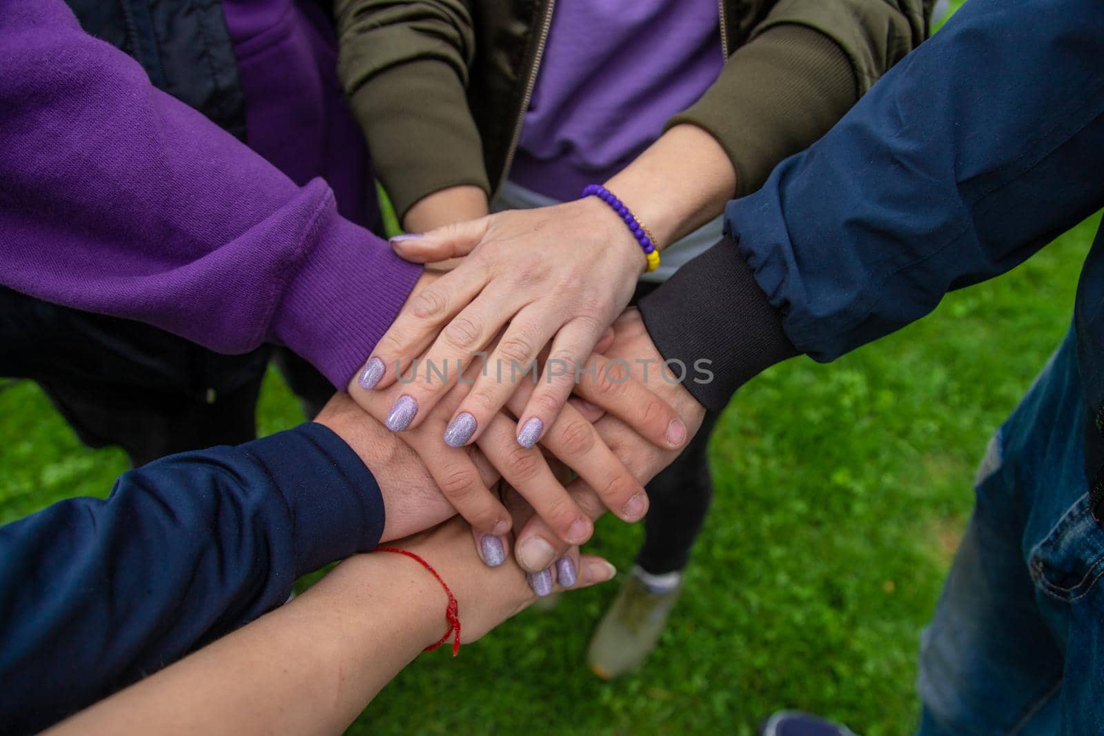 People put their hands together. Selective focus. Couple.