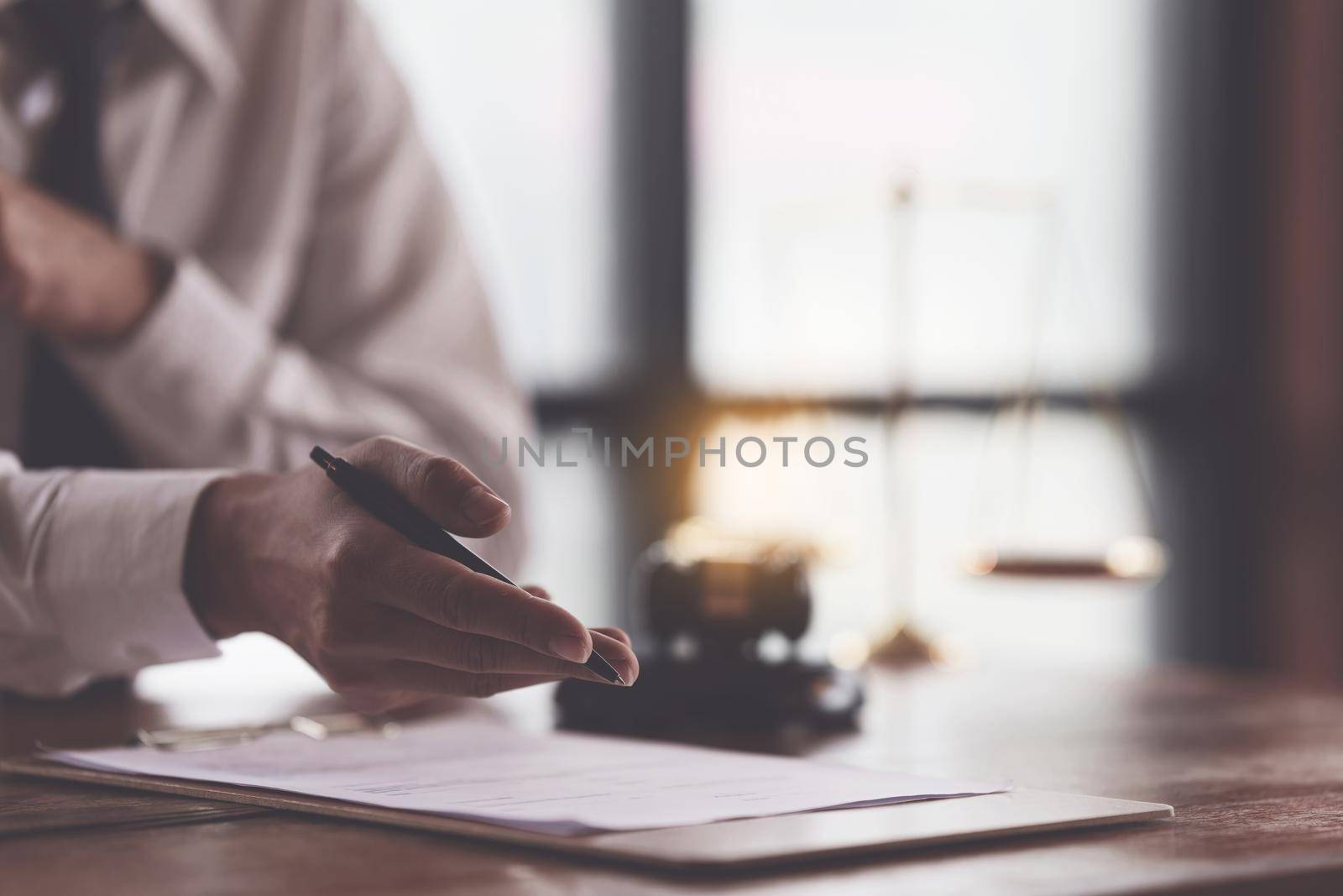 Close up lawyer businessman working or reading agreement contract in office workplace for consultant lawyer concept
